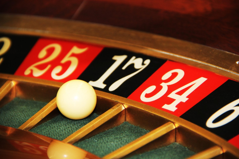 Roulette wheel showing ball in black slot