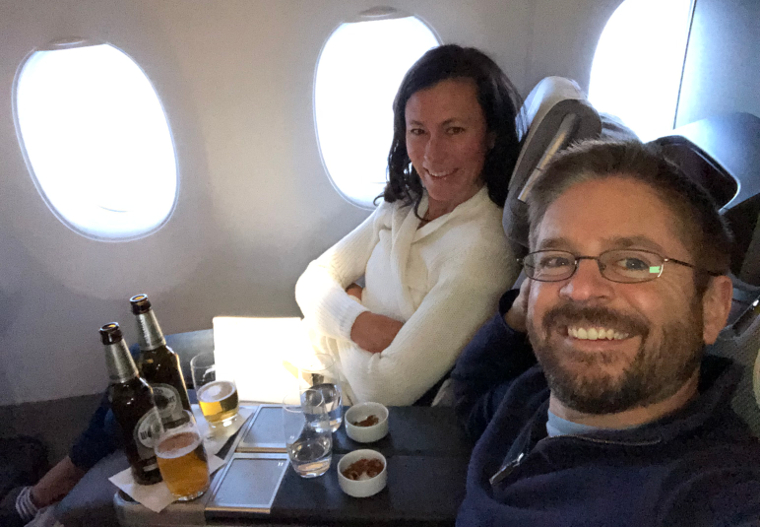 Enjoying snacks and beers in our lie-flat business class seats